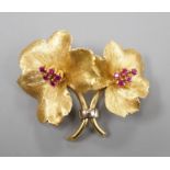 A gold and ruby cluster set double flower head brooch, indistinctly signed, 4cm, gross weight 12.5
