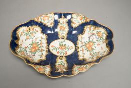 A Worcester scalloped oval dish with blue scale ground painted in kakiemon style with oriental