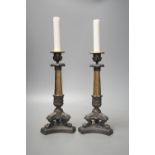 A pair of neo-classical style brass candlesticks,28.5 cms high.