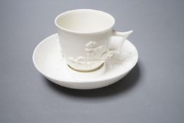A St Cloud white-glazed coffee cup with angular handle and scroll terminal and matching trembleuse