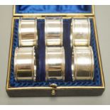 A cased matched set of six early 20th century plain silver napkin rings, by Charles Horner, Chester,