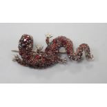 A Victorian gilt white metal and garnet cluster set lizard brooch, 49mm.