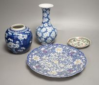 A Chinese blue and white jar, a similar vase, a polychrome plate and a famille verte saucer- plate