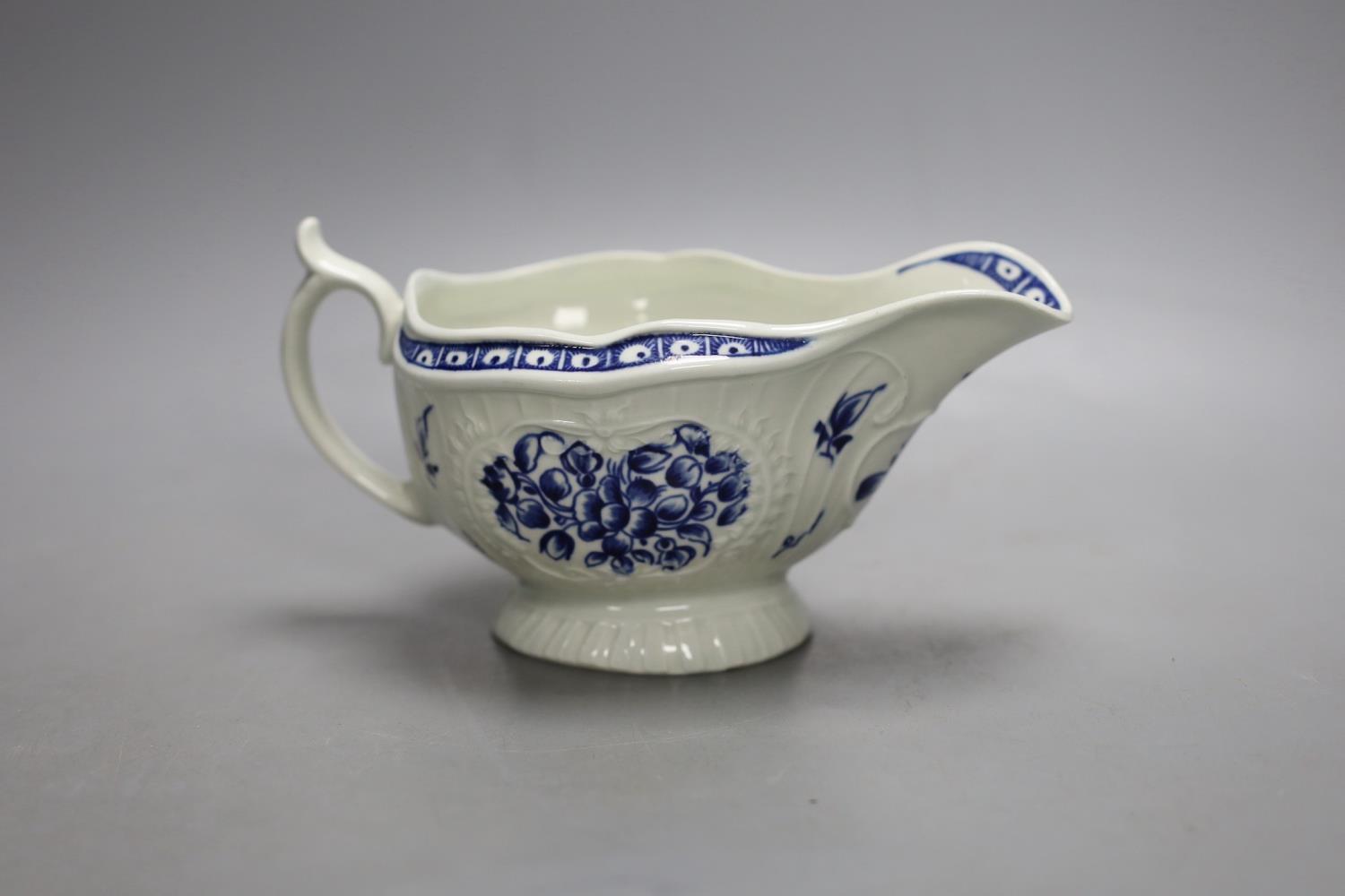 A Worcester sauceboat painted with the Strap Fluted Floral pattern c. 1768-72,16.5 cms wide.