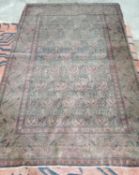 A Persian rug, woven with rows of botehs (worn), approx. 200 x 140cm