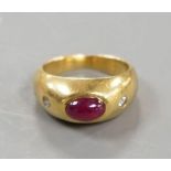 A yellow metal, cabochon ruby and two stone diamond chip set ring, size E/F, gross weight 6.6