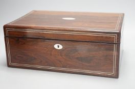 A Victorian rosewood sewing box containing white metal lidded glass bottles,box 37 cms wide x 15 cms