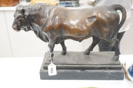 An Animalier style bronzed metal model of a bull, height 35cm