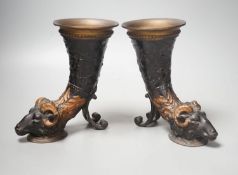 A pair of cold painted bronze ram's head cornucopia vases 19cm tall