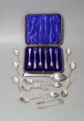 A cased set of six George V silver cake forks, a set of eleven Chinese white metal coffee spoons,