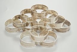 A matched set of thirteen early 20th century plain silver napkin rings, by Charles Horner,