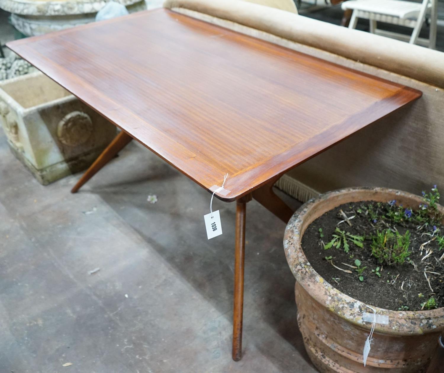 A mid century design G Plan rectangular teak "Helicopter" dining table, length 137cm, width 76cm,