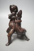 A Carl Karuba bronze of a cherub holding a goose,17.5 cms high.