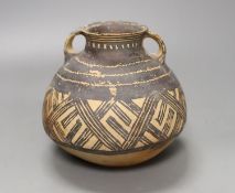 A Chinese neolithic pottery two handled jar - 14cm tall Provenance: the vendor‘s parents lived in