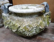 A large circular reconstituted stone ram's head garden planter / fountain head, diameter 66cm,