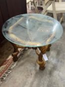 A gilt composition "ropetwist" circular glass top table 66 cm diameter.