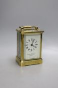 A large brass carriage clock, retail by Charles Frodsham,14.5 cms high.