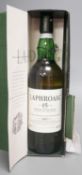 ° ° A cased bottle of Laphroaig single Islay malt whisky signed by Margaret Thatcher.