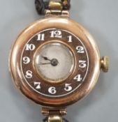 A lady's George V 9ct gold Rolex manual wind wrist watch, with Arabic chapter ring, case