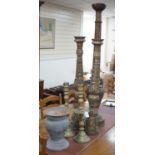 A pair of gilt carved candlesticks, a large turned candlestick, a pair of brass candlesticks and a