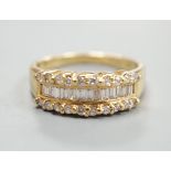 A modern 18ct gold and three row baguette cut diamond and diamond chip set half hoop ring, size M,