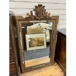 A late 19th century French giltwood and gesso overmantel mirror, with marginal plates, width 90cm