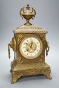 An early 20th century brass mantel clock, 40 cms high.