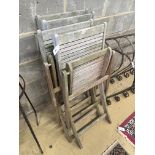 A set of four teak folding garden chairs