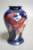 A Moorcroft orchid pattern vase - 15cm tall