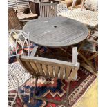 A circular weathered teak folding wooden garden table, diameter 110cm height 72cm, together with