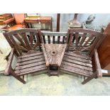 A stained teak duet garden bench, 156 x 54cm height 94cm