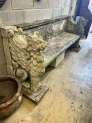 A monumental reconstituted stone winged lion or griffin garden bench, width 250cm depth 66cm