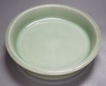 A Korean celadon glazed dish, 19th / 20th century-27 cms diameter.