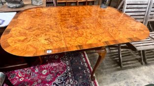 A Queen Anne Walnut revival burr walnut pad foot drop leaf dining table, extended 144cm wdith 99cm