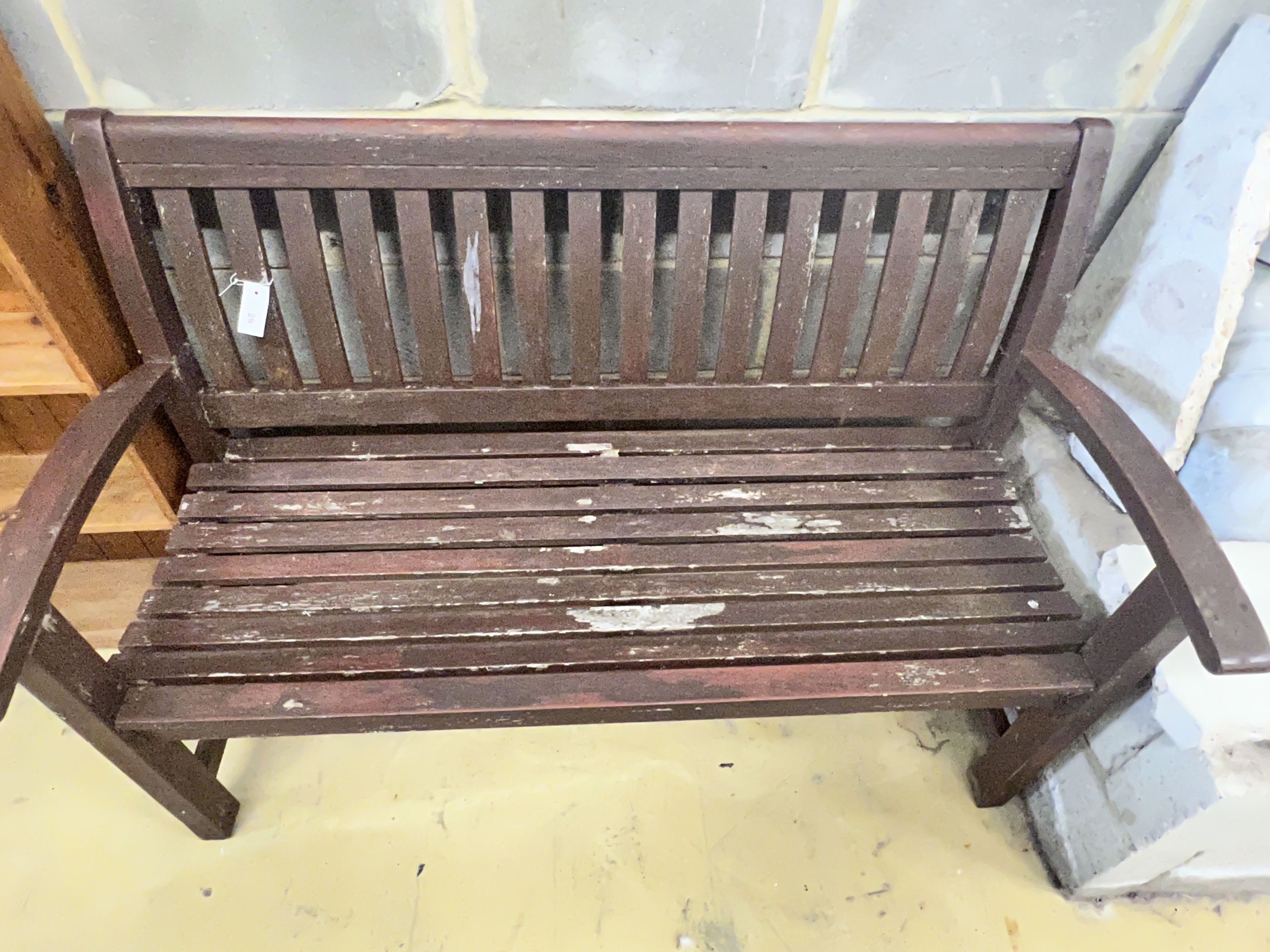 A stained teak slatted garden bench, 138 x 58cm height 92cm - Image 4 of 4