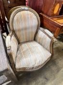 A pair of Louis XVI style painted cream show wood framed bergeres, upholstered in ribbed velvet,