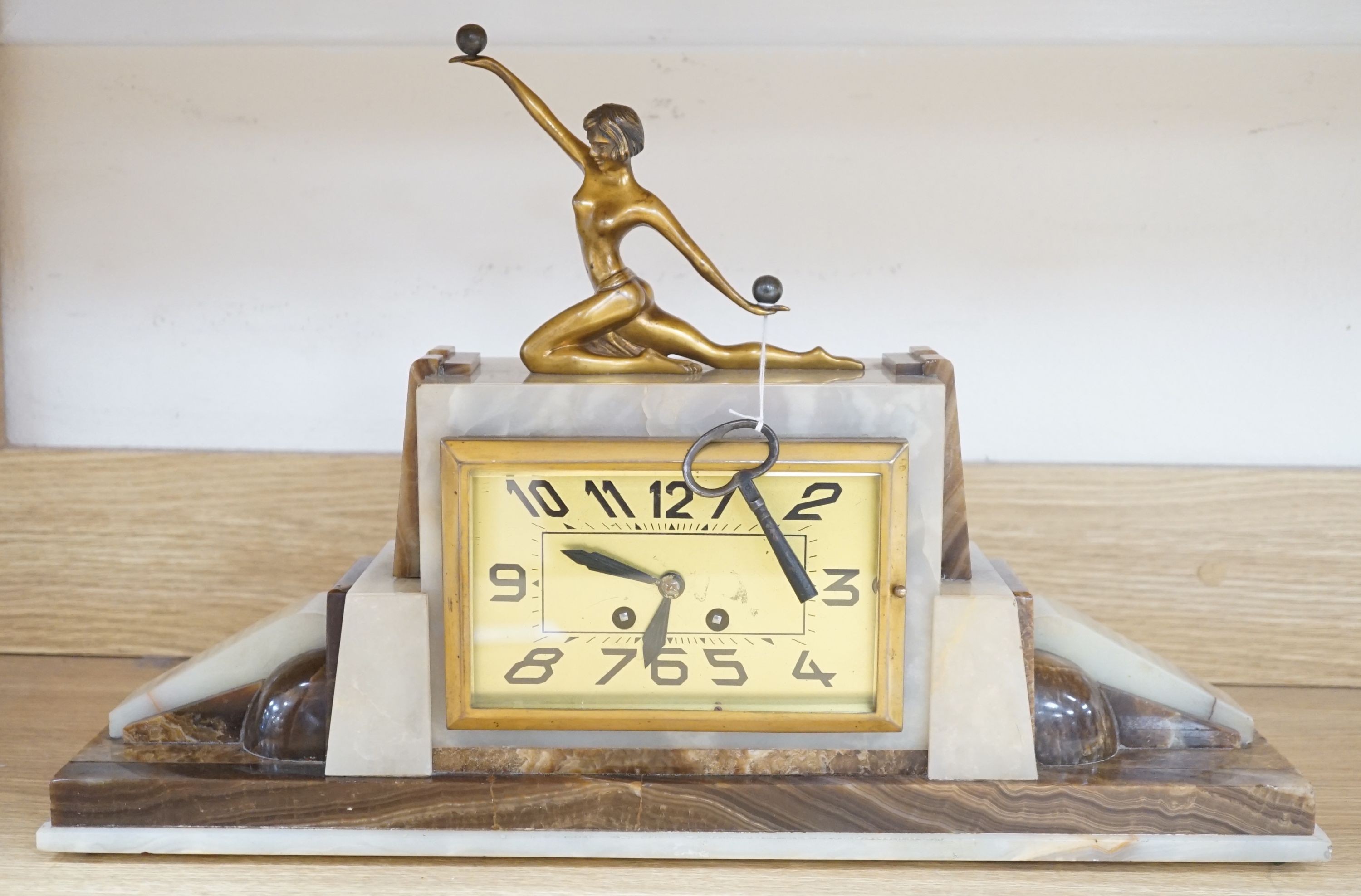 An Art Deco marble and bronze figural clock 52cm
