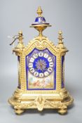 A 19th century French ormolu cased mantel clock, with decorated porcelain panels and face, eight day