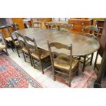 A French style oak extending dining table, with two spares leaves, 280cm extended, width 11cm,