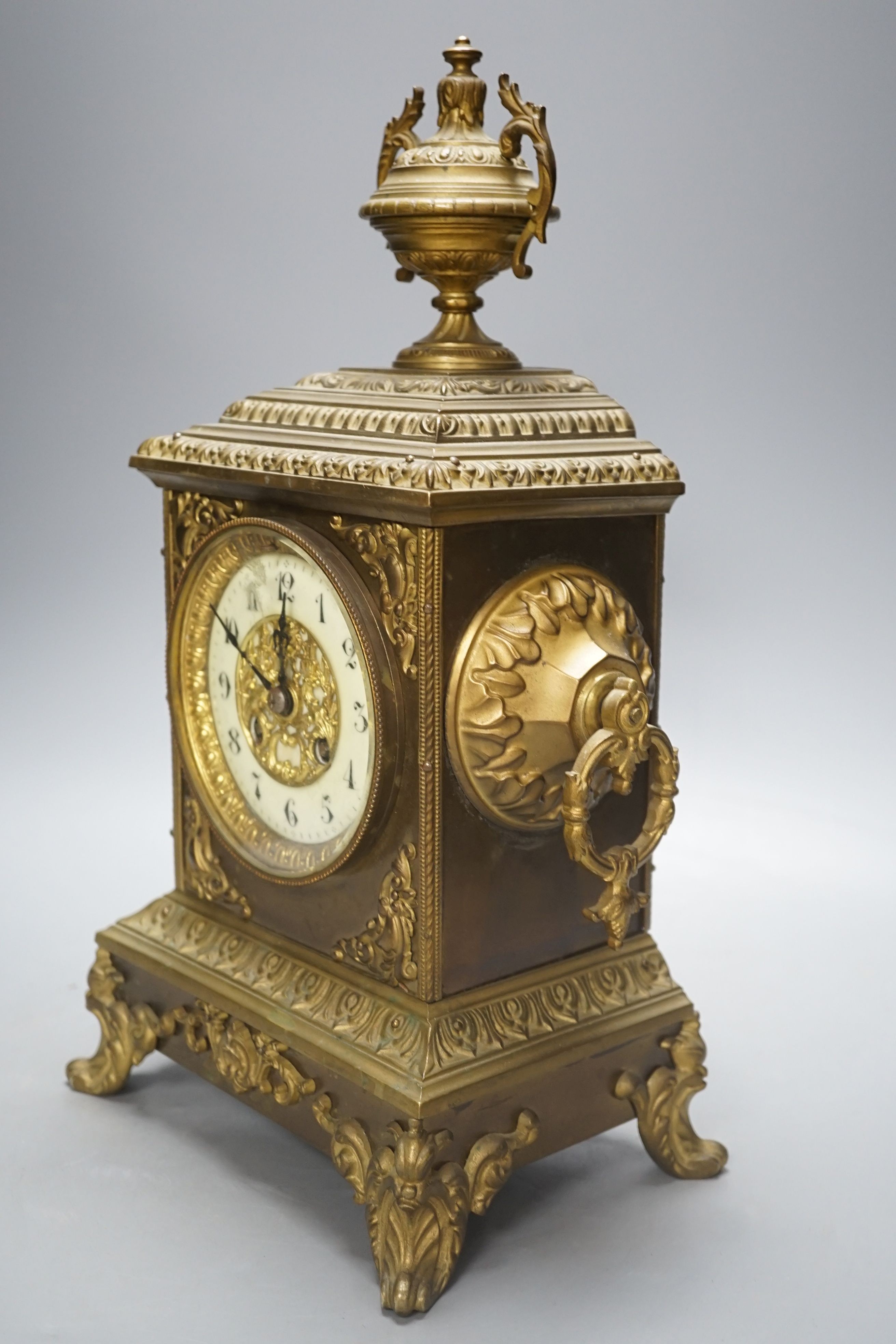 An early 20th century brass mantel clock, 40 cms high. - Image 2 of 5