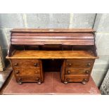 A miniature mahogany and hardwood kneehole tambour desk, width 69cm, depth 22cm, height 45cm.