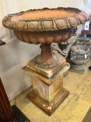 A large terracotta circular campana garden urn on plinth base, diameter 78cm height 118cm