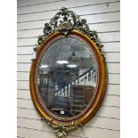 A late 19th century French oval giltwood and gesso wall mirror, later painted, width 81cm height