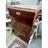 A French Art Deco style amboyna veneered marble topped drinks cabinet, width 61cm depth 40cm