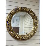 A 19th century circular gilt wood and gesso wall mirror, some later painted detail diameter 76cm