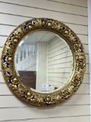 A 19th century circular gilt wood and gesso wall mirror, some later painted detail diameter 76cm