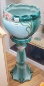 A Staffordshire pottery jardiniere on stand.91 cms high.
