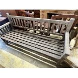 A weathered teak slatted garden bench, width 182cm depth 58cm height 92cm