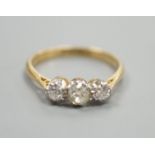 An 18ct & plat, three stone diamond ring, size L, gross weight 2.3 grams.