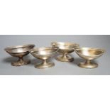 A set of four George III silver boat shaped pedestal salts, London, 1799, maker's mark rubbed,